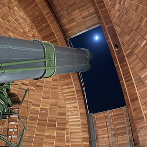 Telescope, openend dome, bright spot in the sky